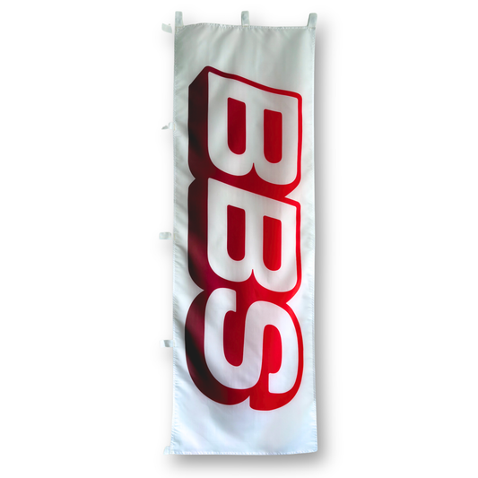 A rectangular flag with a white background featuring the letters 'BBS' in red.