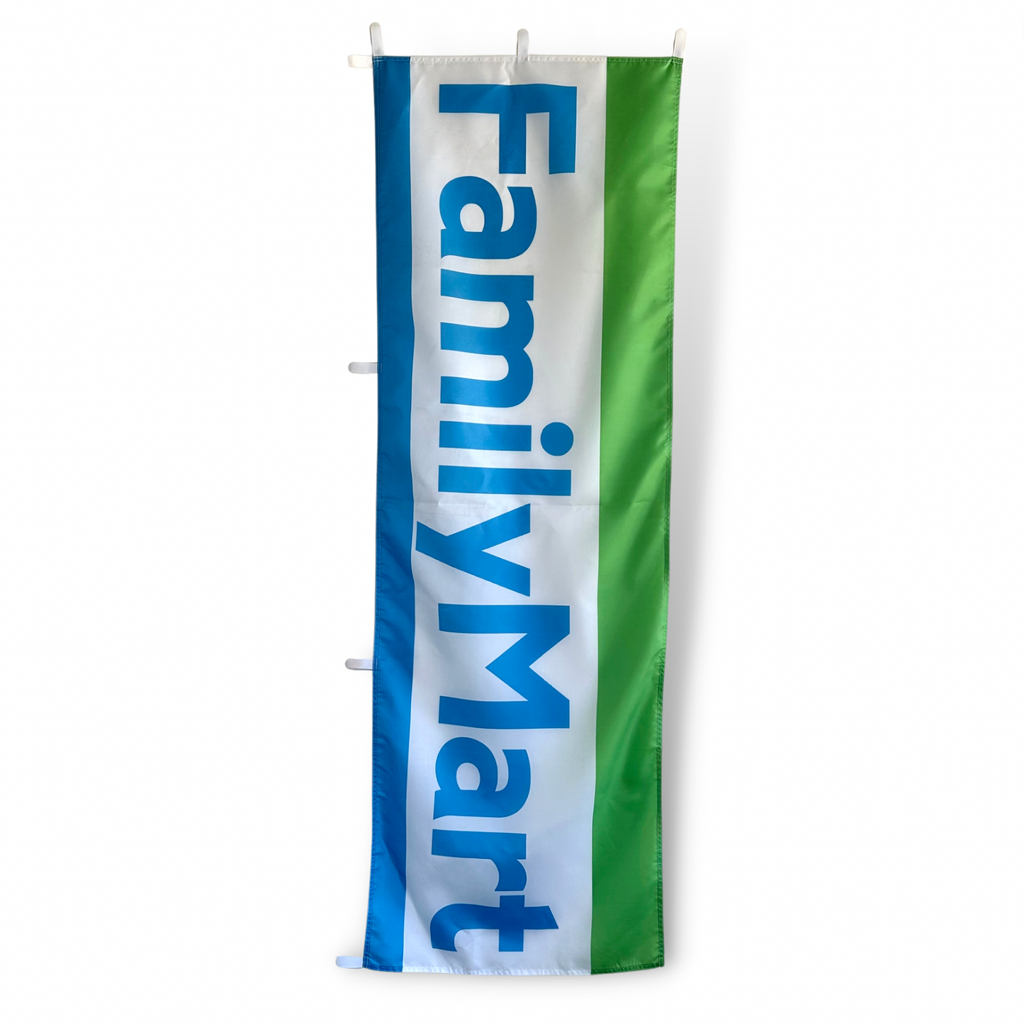 A rectangular flag featuring the Family Mart logo in blue and green colors on a white background