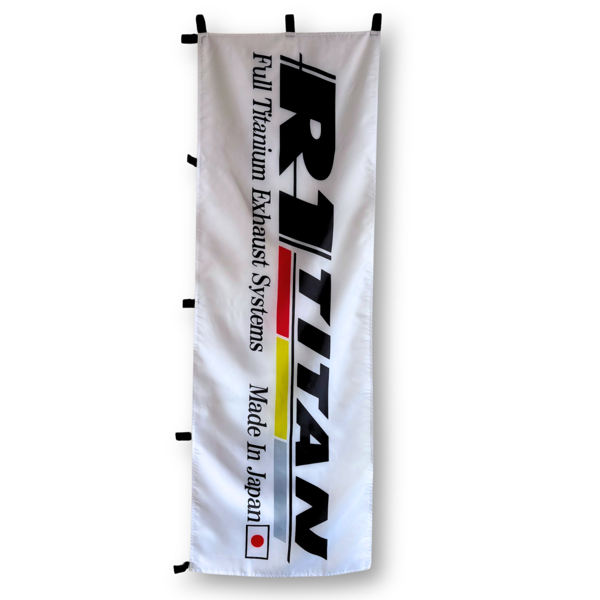 A rectangular flag with a white background featuring the Ritium Exhaust Systems logo and the text 'FULL TITAN EXHAUST SYSTEMS' in red and blue. The flag has a Japanese flag pattern in the corner and the text 'MADE IN JAPAN' at the bottom.