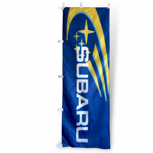 A rectangular Subaru flag with blue field and yellow stars and the Subaru logo in the center.